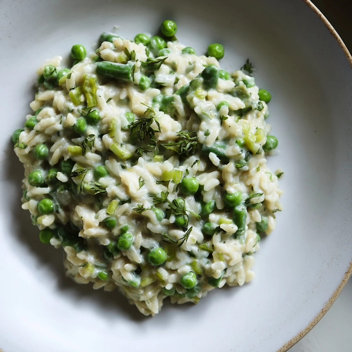 Creamy Parmesan Orzo with Green Peas: A close-up shot of the finished, comforting pasta dish.