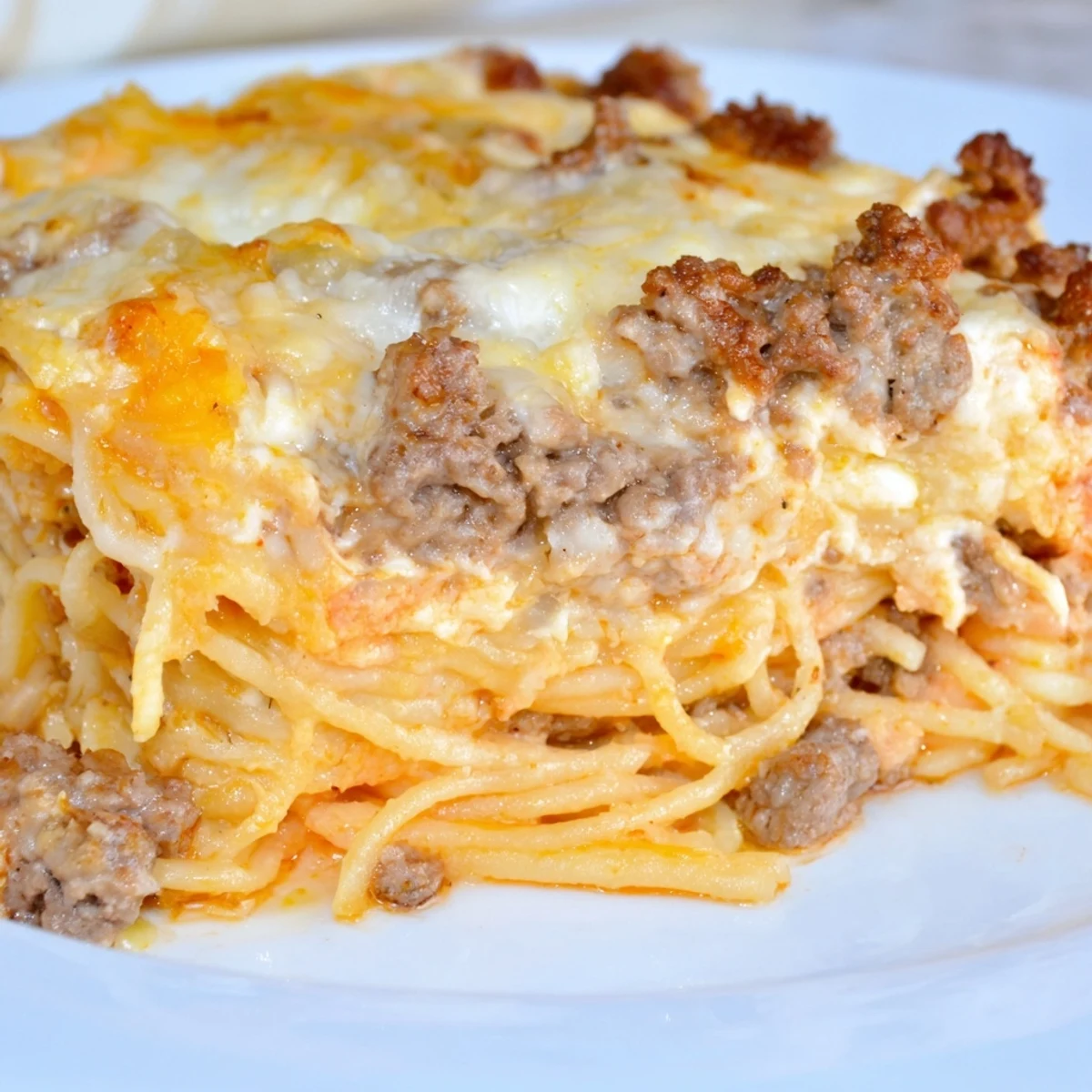 A bubbling casserole of Million Dollar Spaghetti, with melted cheese and rich, savory layers.