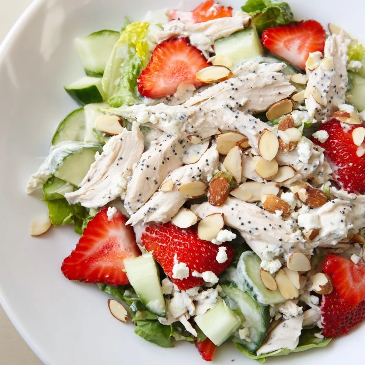 Freshly poached shredded chicken, sliced strawberries, and crisp cucumbers tossed in creamy poppy seed dressing.  