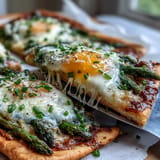Golden Asparagus and Egg Flatbread, showcasing tender greens and a runny yolk.