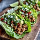 Juicy {{Turkey Taco Lettuce Wraps (Low Carb)}} piled high in crisp leaves.