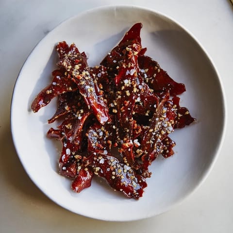 Crispy Sweet and Salty Honey Toasted Cashews, warm from the oven, ready to enjoy as a treat.