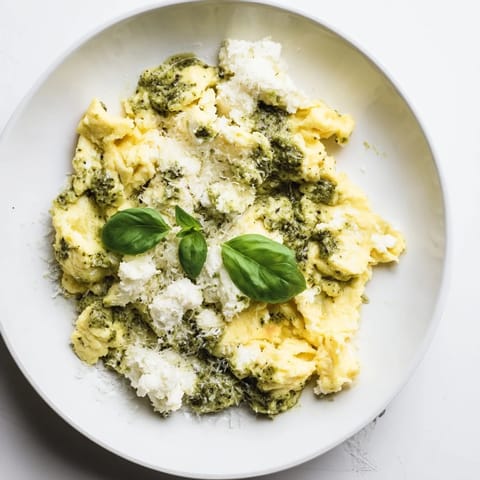 Warm, creamy Pesto Cottage Cheese Eggs, a quick and delicious high-protein vegetarian meal.